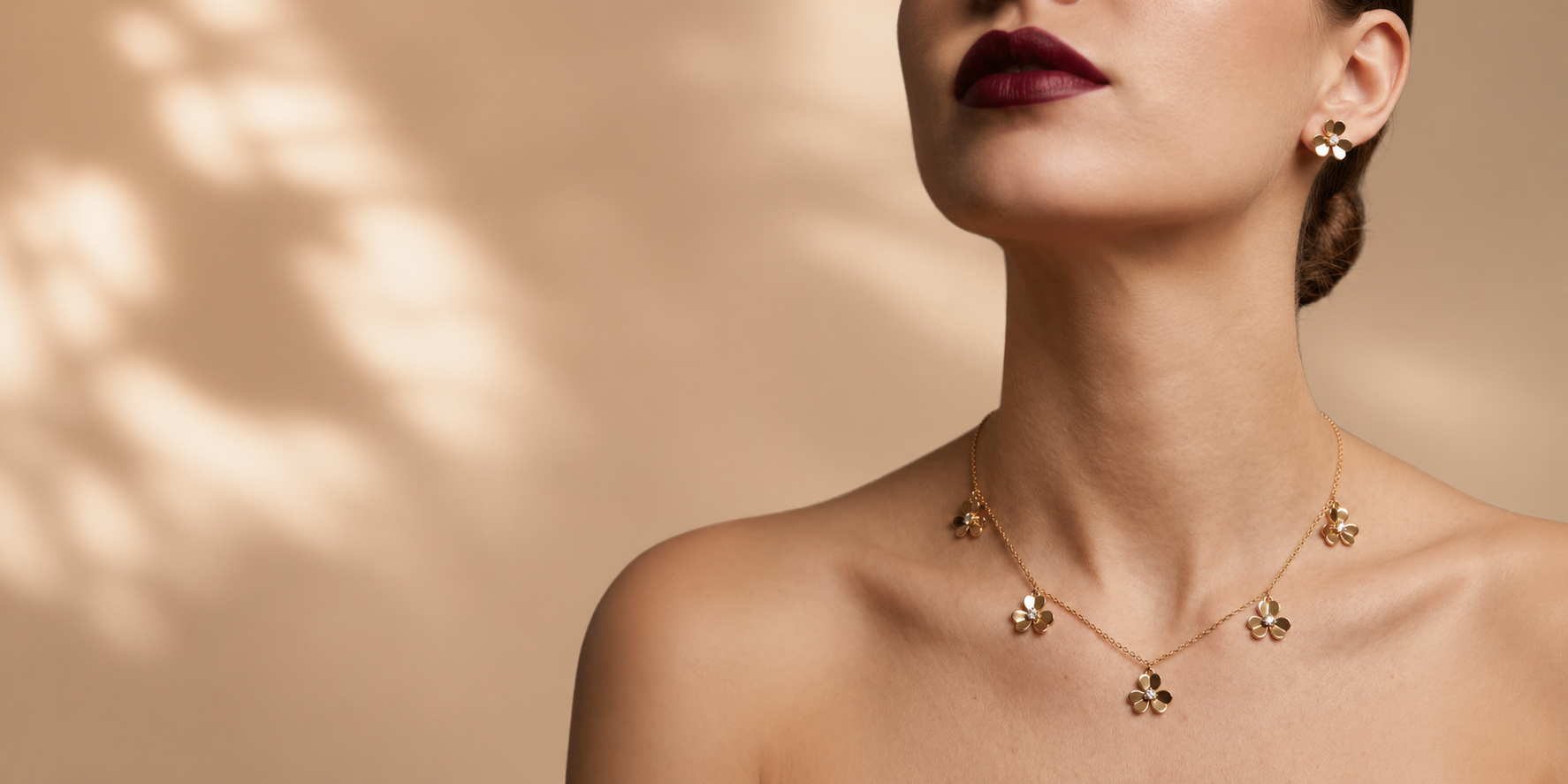 Prestige Accessories — gold floral jewelry on model